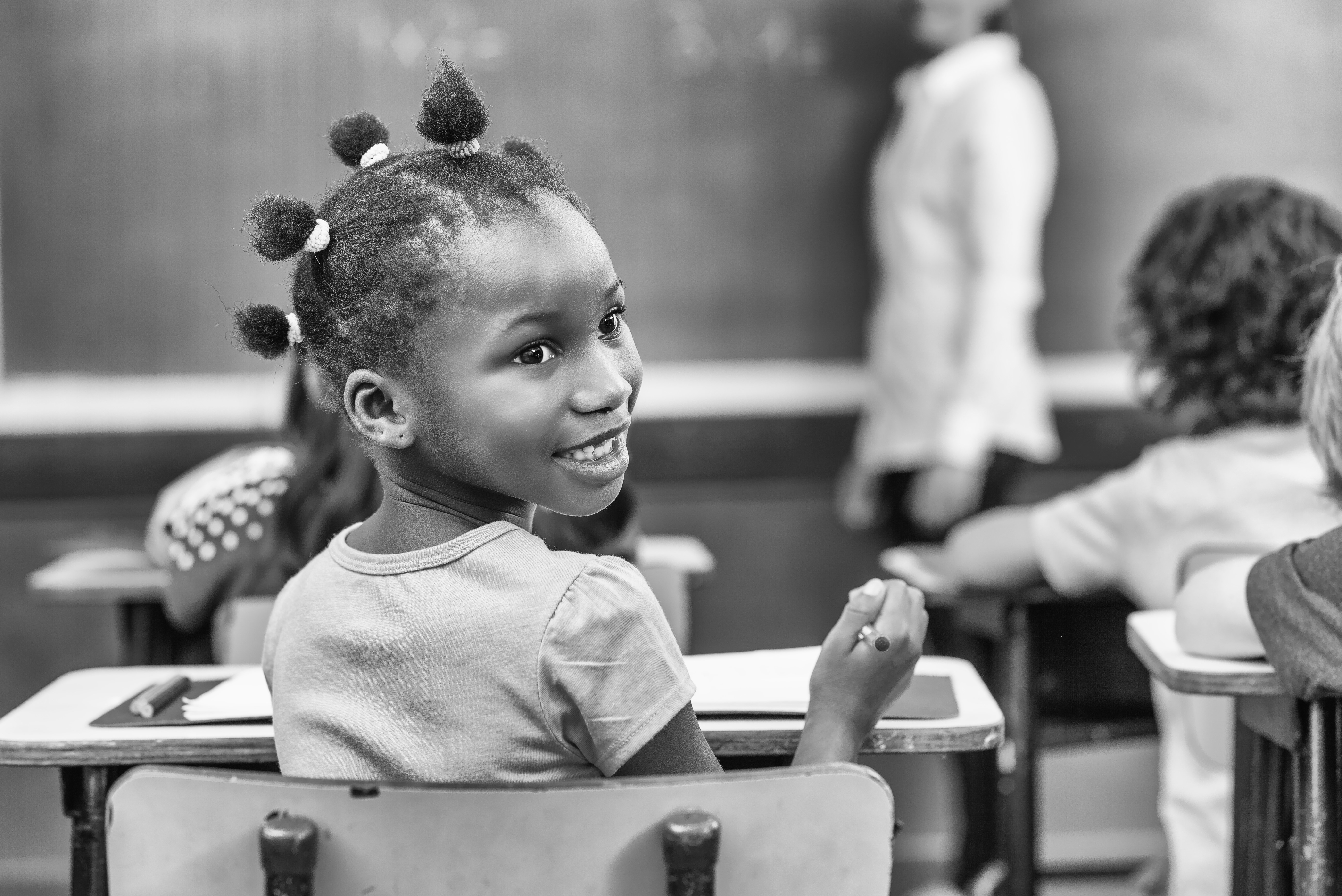 African girl turning in her chair at primary school. From GCIR's Black History Month: Diversity and Strength of the Black Immigrant Community in the U.S. webinar.