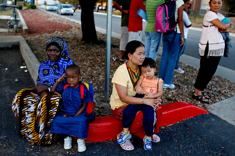 Two-families-at-the-bus-stop