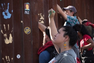 Group of people gathered at the Mexico-US Border Wall