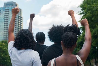 A group of African American people protest racial injustice.
